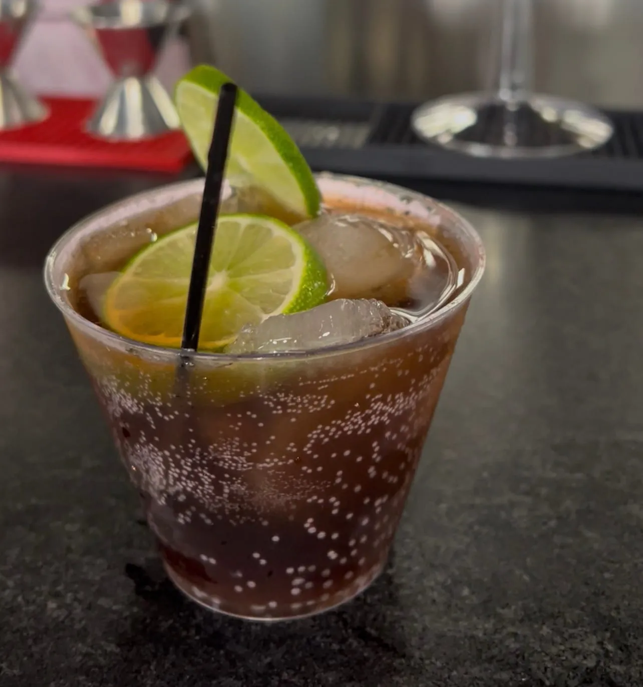 A tall drink with fresh lime