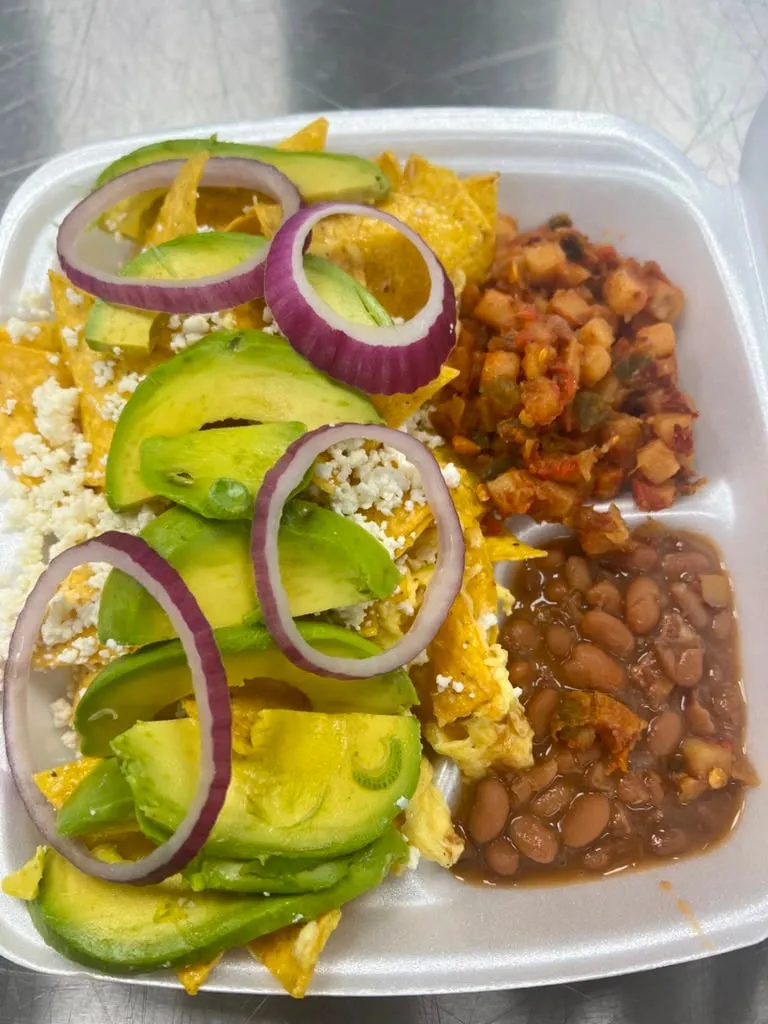Chilaquiles with avocado, red onion and queso fresco