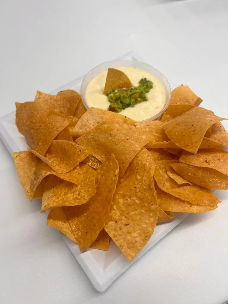 Tortilla chips with queso